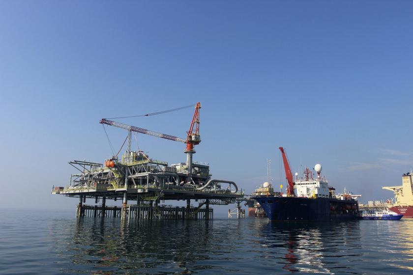 A ship is docked at Al-Basra oil terminal, next to a Central Meeting and Manifold Platform belonging to Iraq's Southern Oil Company in the Middle East Gulf November 27, 2013.