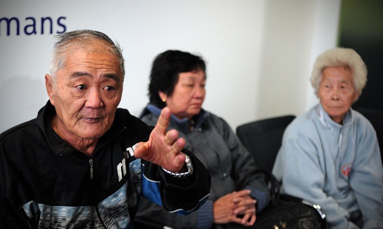 Picture shows Loh Ah Choi, a relative of Malaysian rubber plantation workers killed in Batang Kali in 1948, speaking during a press conference with Chong Koon Ying (centre) and Lim Ah Yin (right) and their lawyers in London on May 7, 2012. — File pic