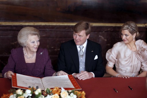 Queen Beatrix hands over the Act of Abdication to her son and heir Prince Willem-Alexander and Princess Maxima in Amsterdam on April 30, 2013. u00e2u20acu201d AFP pic