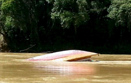 An overturned boat is seen floating in Rajang River, near Belaga, in Sarawak on May 28, 2013. u00e2u20acu201d AFP pic
