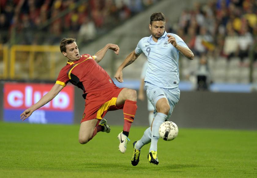 Belgium's Nicolas Lombaerts (left) fights for the ball with France's Olivier Giroud during an international riendly match at King Baudouin stadium in Brussels August 14, 2013.u00c2u00a0u00e2u20acu201c Reuters pic