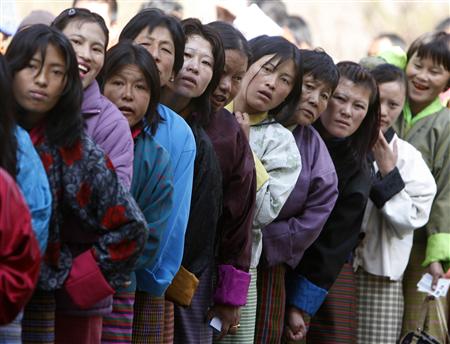 Bhutanese voters stand in a queue outside a polling station to cast their ballot in Thimpu March 24, 2008. u00e2u20acu201d Reuters file pic