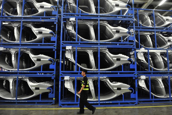 File photo of security personnel walking inside a BMW factory in Shenyang, Liaoning province, July 6, 2013. u00e2u20acu201d Reuters pic