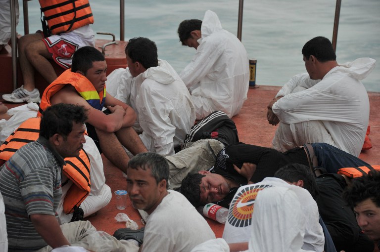 Asylum-seeker survivors are seen onboard an Indonesian rescue boat at Merak seaport on August 31, 2012. u00e2u20acu201c AFP pic