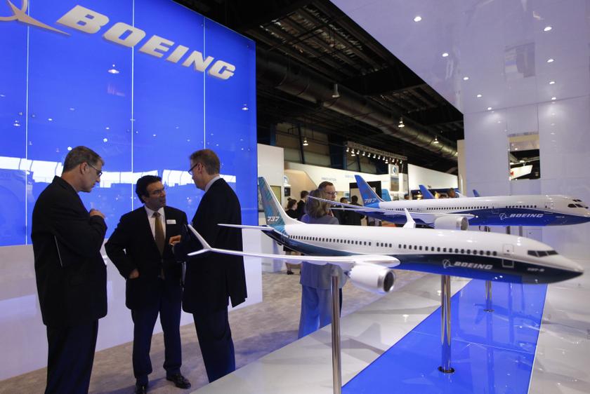 Visitors talk at the Boeing booth at the Singapore Airshow February 11, 2014.  u00e2u20acu201d Reuters pic