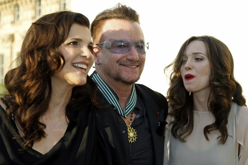 Musician Bono (C), lead singer of the band U2, poses with his wife Ali Hewson and their daughter Eve Hewson (R) after being awarded as Commandeur des Arts et lettres (Commander in the Order of Arts and Letters) by French Culture Minister Aurelie Filippett