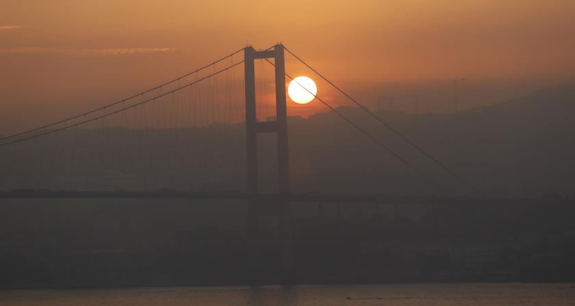 The sun rises over the Bosphorus Bridge that links the city's European and Asian sides in Istanbul October 10, 2013. u00e2u20acu201d Reuters pic