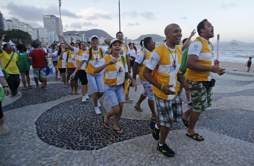Pilgrims dance and sing at Copacabana beach ahead of Pope Francis' visit to Rio de Janeiro July 21, 2013
