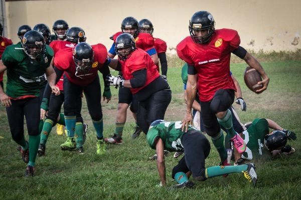 Players of the Brazilian American football team Cuiaba Arsenal practice in a football field in Cuiaba, Mato Grosso state, Brazil, on November 11, 2013. u00e2u20acu201d AFP pic