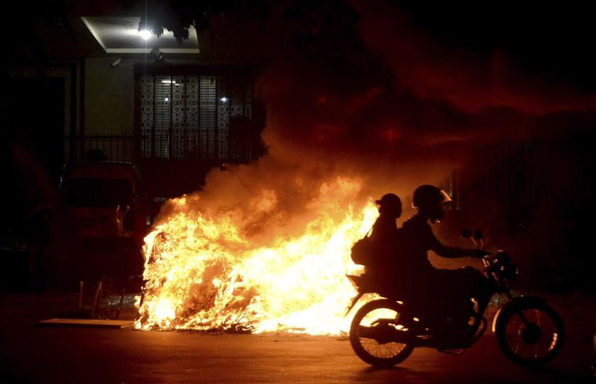 A motorcycles passes a bonfire during a protest by members of the 'Free Pass' movement to demand zero tariffs in the Brazilian public transport system in Rio de Janeiro February 7, 2014. u00e2u20acu201d Reuters pic