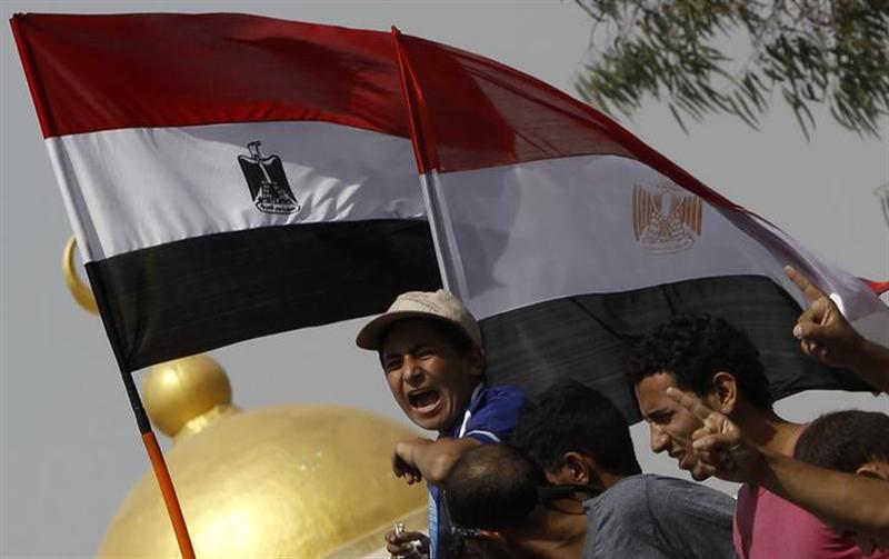 Members of the Muslim Brotherhood and supporters of deposed Egyptian President Mohamed Mursi shout slogans in front of army soldiers at Republican Guard headquarters in Nasr City, a suburb of Cairo July 8, 2013. u00e2u20acu201c Reuters pic