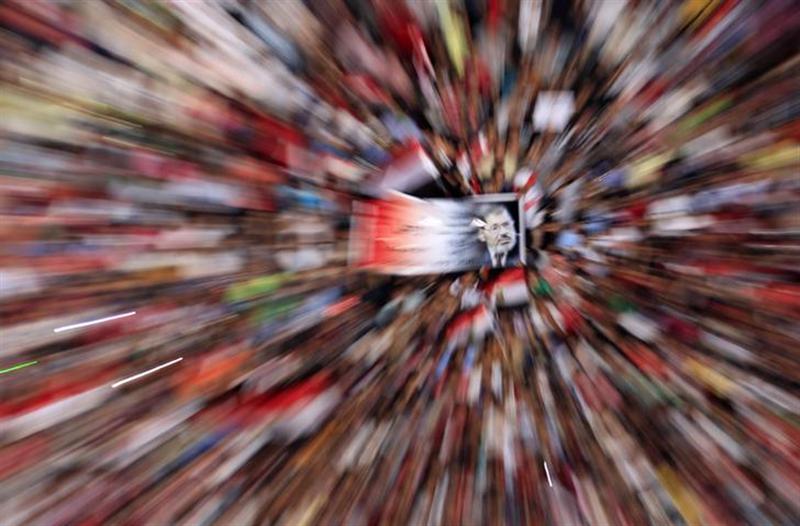 Protesters holding a poster opposing Egyptian President Mohamed Mursi shout slogans against him and Brotherhood members during a protest at Tahrir square in Cairo July 1, 2013. u00e2u20acu201d Reuters pic