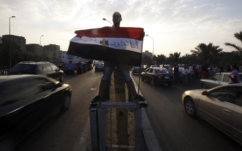 A protester opposing Egyptian President Mohamed Mursi holds an Egyptian flag as he shouts slogans against Mursi and members of the Muslim Brotherhood in front of the Presidential Palace 'Qasr Al Quba' in Cairo July 2, 2013. u00e2u20acu201d Reuters pic