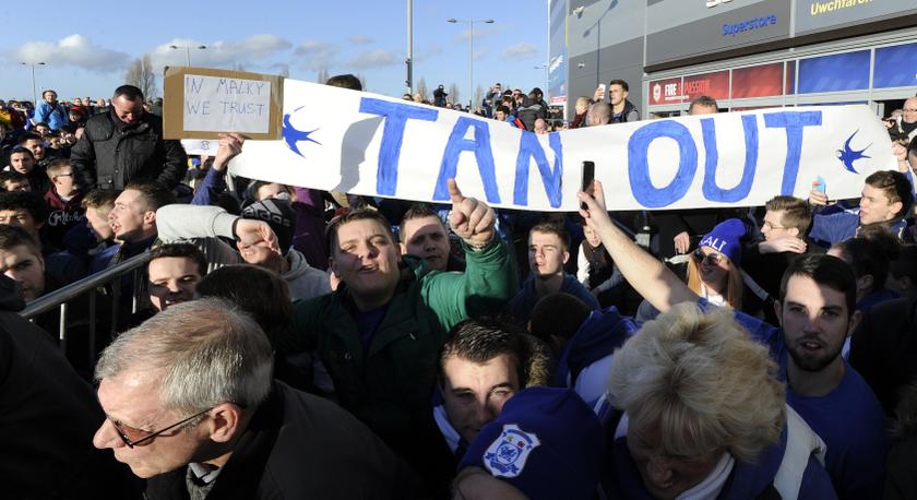 Cardiff City supporters sit down and hold up a banner to protest against club owner Vincent Tan before their English Premier League match against Southampton at Cardiff City Stadium, Wales, December 26, 2013. u00e2u20acu201d Reuters pic