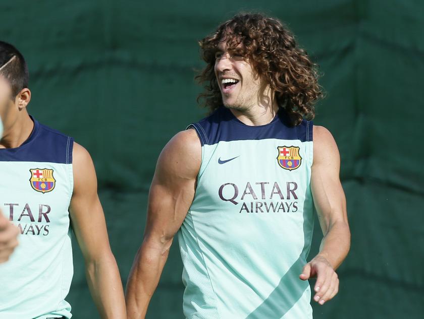 FC Barcelona's Carles Puyol smiles to his teammates during a training session at the Sport Center FC Barcelona Joan Gamper in Sant Joan Despi near Barcelona, October 18, 2013. u00e2u20acu201d Reuters pic