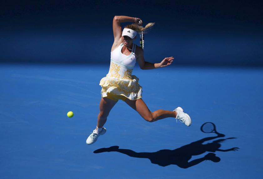 Caroline Wozniacki of Denmark hits a return to Lourdes Dominguez Lino of Spain during their womenu00e2u20acu2122s singles match at the Australian Open 2014 tennis tournament in Melbourne January 14, 2014. u00e2u20acu201d Reuters pic
