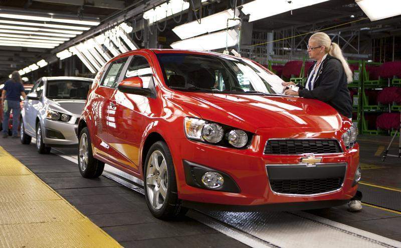 General Motors employee Peggy Burnside inspects a 2012 Chevrolet Sonic as it rolls off the assembly line at the GM Orion assembly plant on September 14, 2011 in Lake Orion, Michigan. u00e2u20acu201d Reuters pic