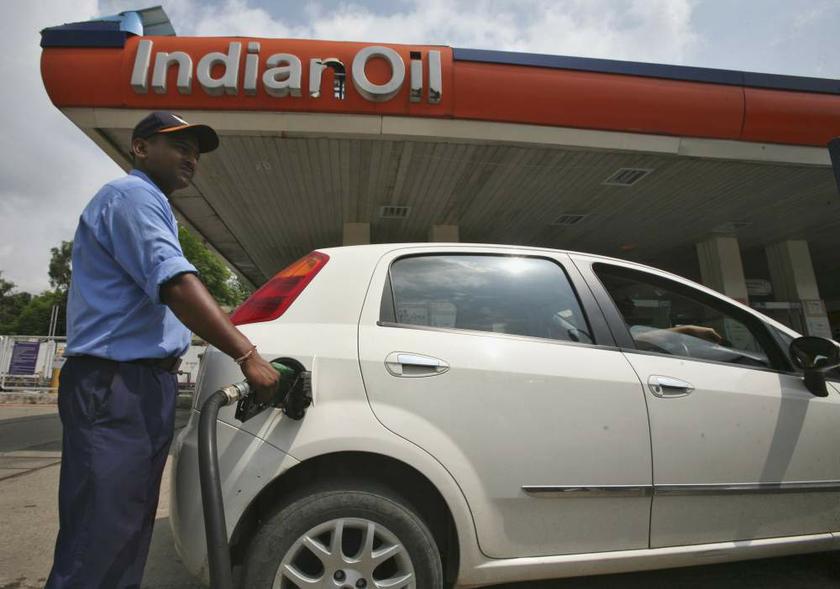 A worker fills a car with diesel at a fuel station in Jammu, India-administered Kashmir on August 29, 2013. u00e2u20acu201d Reuters pic