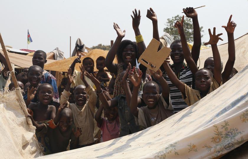 Children gesture as they celebrate the resignation of Central African Republicu00e2u20acu2122s interim President Michel Djotodia at Bangui airport camp January 10, 2014. u00e2u20acu2022 Reuters picn