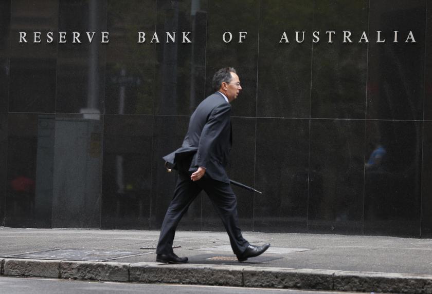 A businessman walks past the Reserve Bank of Australia in Sydney February 4, 2014. u00e2u20acu201d Reuters pic