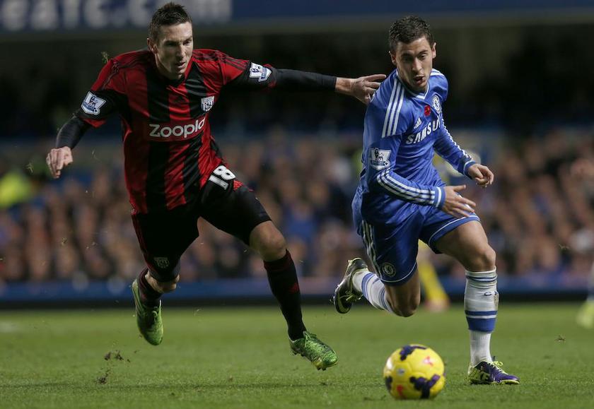 Chelseau00e2u20acu2122s Eden Hazard challenges West Bromwich Albionu00e2u20acu2122s Morgan Amalfitano during their English Premier League match at Stamford Bridge in London November 9, 2013. u00e2u20acu201d Reuters pic