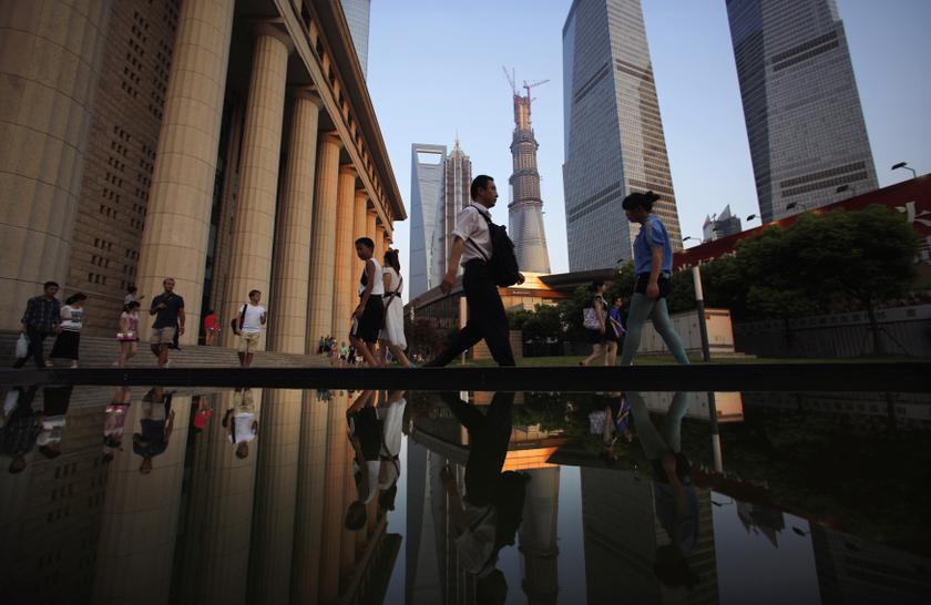 People walk to a subway station at the financial district of Pudong in Shanghai in this July 23, 2013 file photo. u00e2u20acu201c Reuters pic