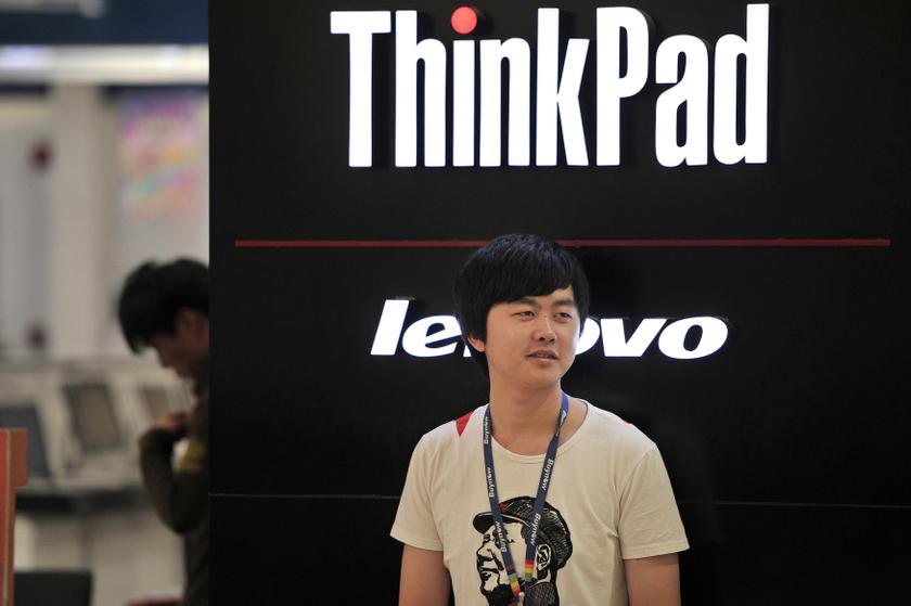 A man wearing a T-shirt with an image of China's late Chairman Mao Zedong stands outside a Lenovo shop in Hefei, Anhui province, October 18, 2013. u00e2u20acu201d Reuters pic
