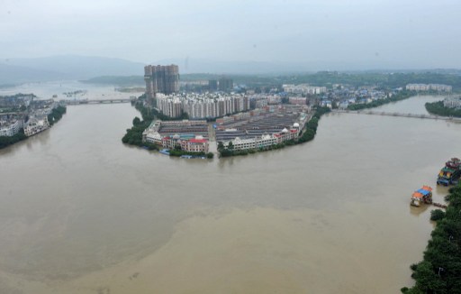 The Tuo river floods Jintang county, southwest China's Sichuan province on July 11, 2013. u00e2u20acu201d AFP pic