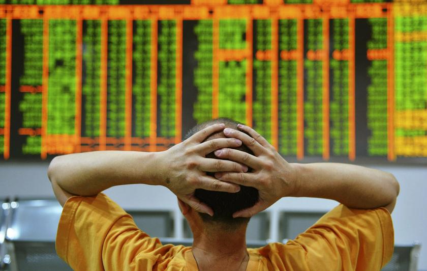 An investor sits in front of an electronic board showing stock information at a brokerage house in Hangzhou, Zhejiang province, June 24, 2013. u00e2u20acu201d Reuters pic
