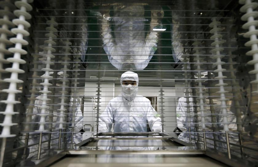 An employee works inside an electronic products factory in Huzhou, Zhejiang province, June 25, 2013. u00e2u20acu201d Reuters pic