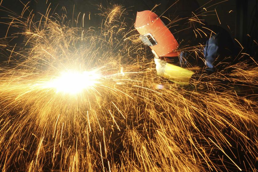 A worker welds inside a factory in Chongqing municipality, June 25, 2013. u00e2u20acu201d Reuters pic