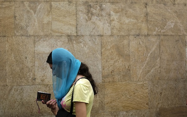 A woman reads a prayer book during a religious service marking the Day of the Virgin Mary at Sioni Cathedral in Tbilisi August 29, 2013. u00e2u20acu201d Reuters pic