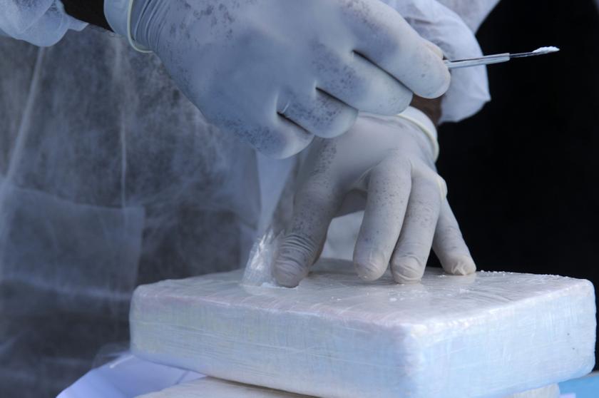 A member of the national police inspects the quality of cocaine before it is burned inside a military base in Santo Domingo October 10, 2013. u00e2u20acu201d Reuters pic