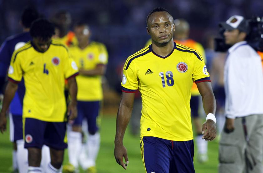 Colombia's Camilo Zuniga (right) and Juan Guillermo Cuadrado react after their defeat to Uruguay during their 2014 World Cup qualifying soccer match in Montevideo, Sept 10, 2013  u00e2u20acu201d Reuters pic