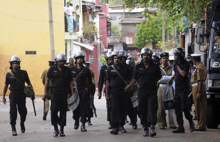Sri Lanka's riot police patrol outside a vandalised mosque in Colombo August 11,2013. u00e2u20acu201c Reuters pic