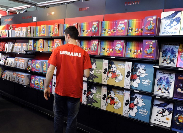 File photo of a bookseller checking his comic books on shelves on the last day during the Comic book festival of Angouleme on February 3, 2013 in Agouleme, France. u00e2u20acu201d AFP pic