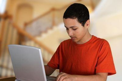 Digital technologies mean that students can learn at home watching videos on their computer, tablet or smartphone, listening to the lesson as many times as necessary and at their own pace while taking notes. u00e2u20acu201d Picture courtesy of shutterstock.com