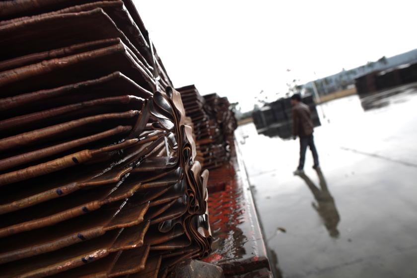 A man stands near copper cathodes on a truck at a near Yangshan Deep Water Port, south of Shanghai, March 23, 2012. u00e2u20acu201c Reuters pic
