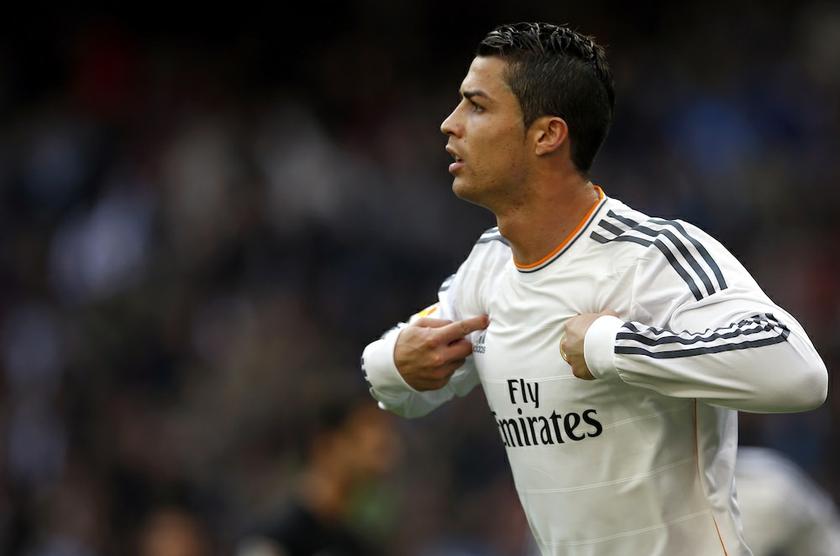 Real Madridu00e2u20acu2122s Cristiano Ronaldo celebrates after scoring a goal against Real Sociedad during their Spanish first division match at Santiago Bernabeu stadium in Madrid November 9, 2013. u00e2u20acu201d Reuters pic