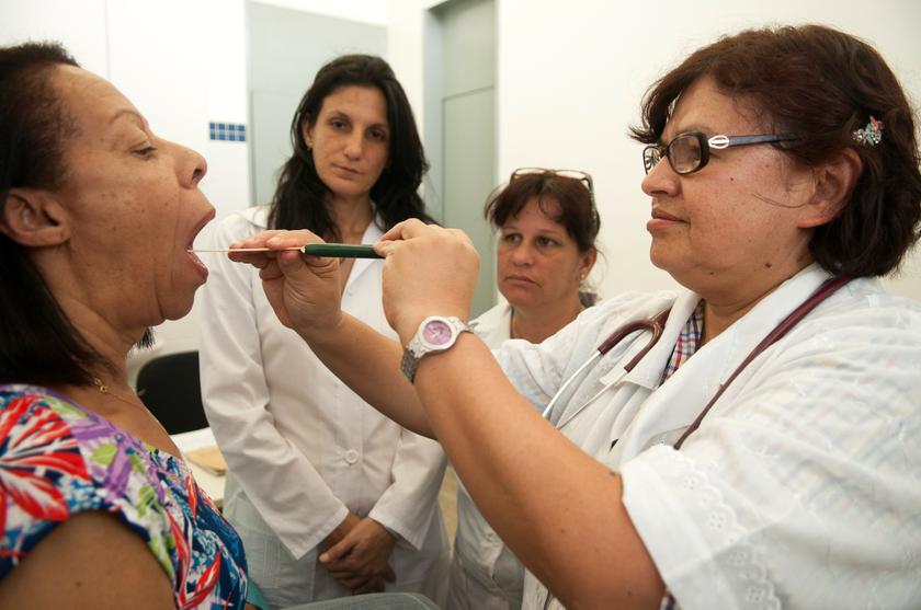 Cuban doctors Yadira Rojas (second left) and Lucia Lunes (second right), involved in the Brazilian government's 'More Doctors' programme, observe Brazilian doctor Norma Negreto (right) during a medical procedure in Brasilia November 11, 2013. u00e2u20acu201d Reuters 