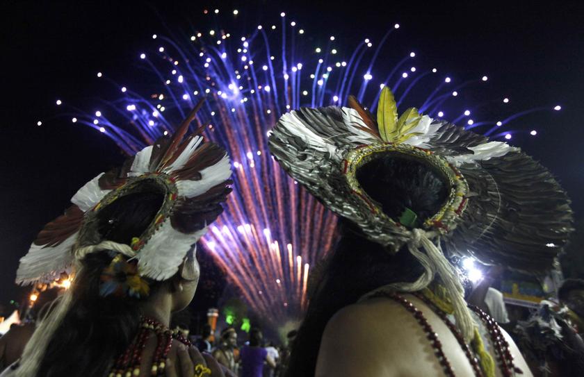 Brazilian indigenous people watch fireworks exploding in the sky during the closing ceremony of the XII Games of the Indigenous People in Cuiaba November 16, 2013. — Reuters pic