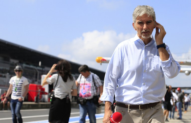 Former F1 driver Damon Hill walks in the pits during the third practice session at the Nurburgring race track on July 6, 2013 in Nurburg ahead of the German Formula One Grand Prix. u00e2u20acu201d AFP pic