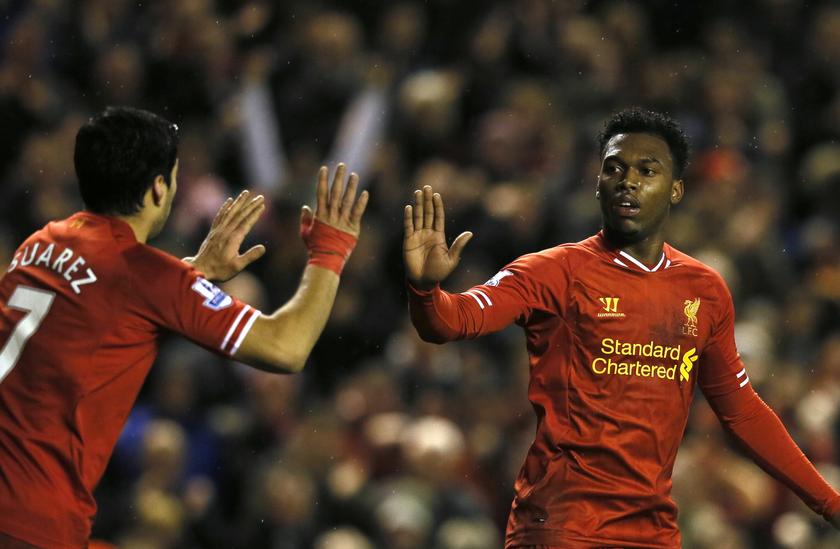 Liverpool's Daniel Sturridge (right) celebrates with teammate Luis Suarez after scoring a goal against Aston Villa during their English Premier League match at Anfield in Liverpool, northern England January 18, 2014. u00e2u20acu201d Reuters pic
