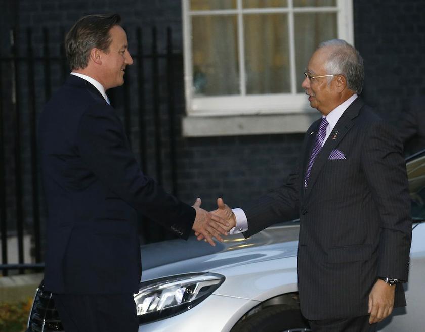 Britainu00e2u20acu2122s Prime Minister David Cameron greets his Malaysian counterpart Datuk Seri Najib Razak at Number 10 Downing Street in London October 29, 2013. u00e2u20acu201d Reuters pic