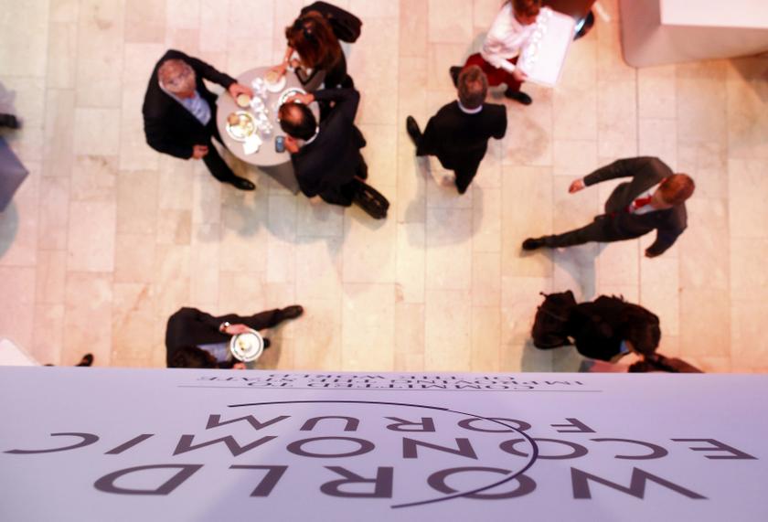 Participants walk during a break in sessions at the World Economic Forum (WEF) in Davos January 25, 2014. u00e2u20acu201d Reuters pic