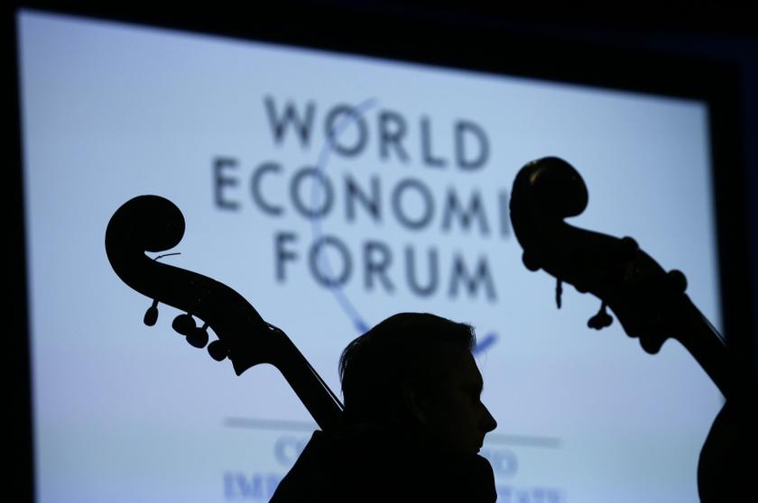 A musician of the St Petersburg Mariinsky Theatre Orchestra is silhouetted as he listens during the Crystal Awards Ceremony at the annual meeting of the World Economic Forum (WEF) 2014 in Davos January 21, 2014. u00e2u20acu201d Reuters pic