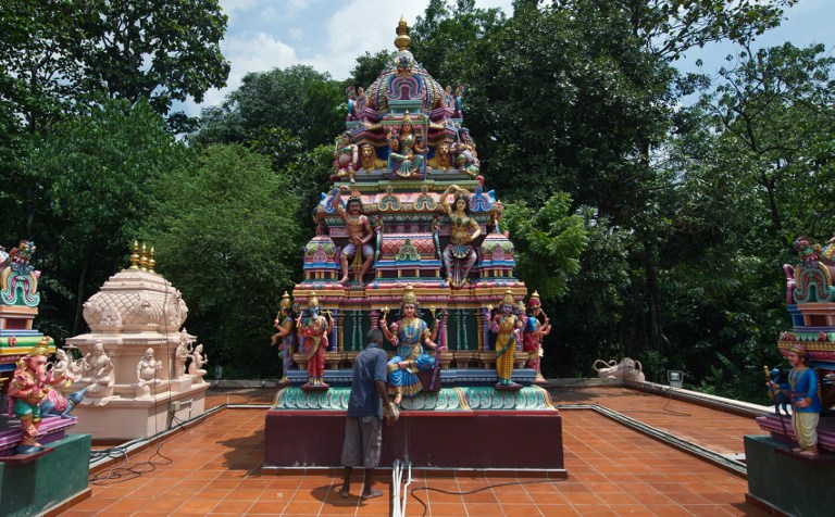 An Indian man cleans a statue at a Hindu temple ahead of the Hindu festival of Diwali in Ampang, in the suburbs of Kuala Lumpur on October 30, 2013. u00e2u20acu201d AFP pic