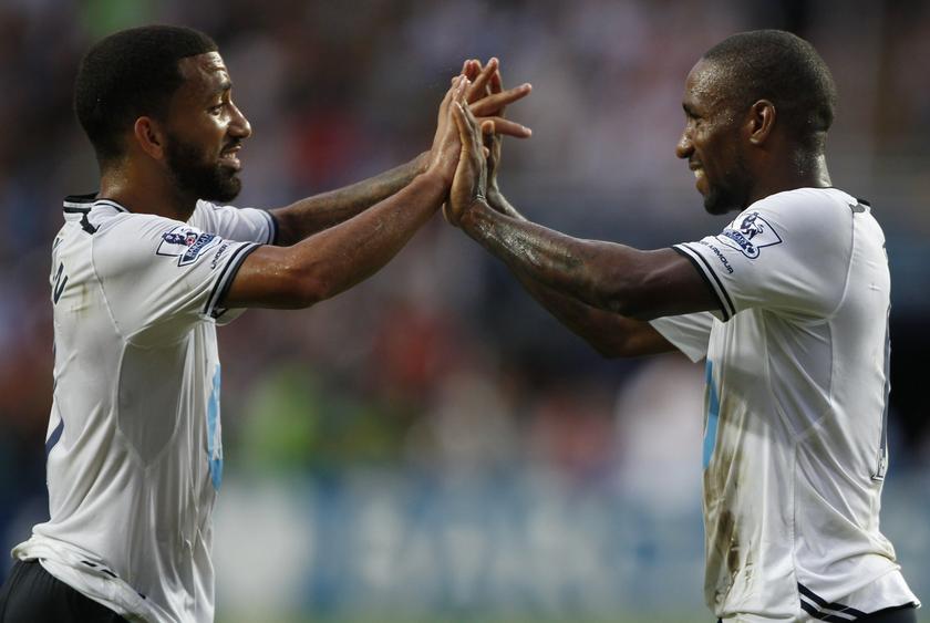 Tottenham Hotspur's Jermain Defoe (right) celebrates with teammate Aaron Lennon after Defoe scored a goal against South China during their Barclays Asia Trophy friendly tournament in Hong Kong July 27, 2013.  u00e2u20acu201c Reuters pic