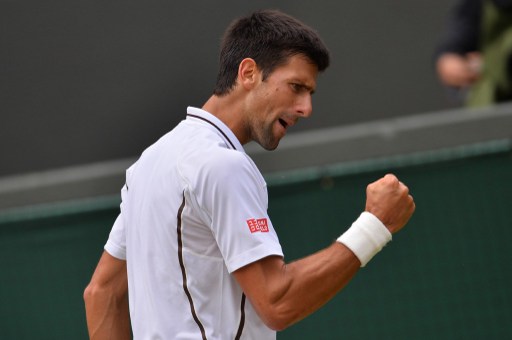 Serbiau00e2u20acu2122s Novak Djokovic celebrates winning a point against Czech Republic's Tomas Berdych during their menu00e2u20acu2122s singles quarter-final match at Wimbledon July 3, 2013. u00e2u20acu201d AFP pic