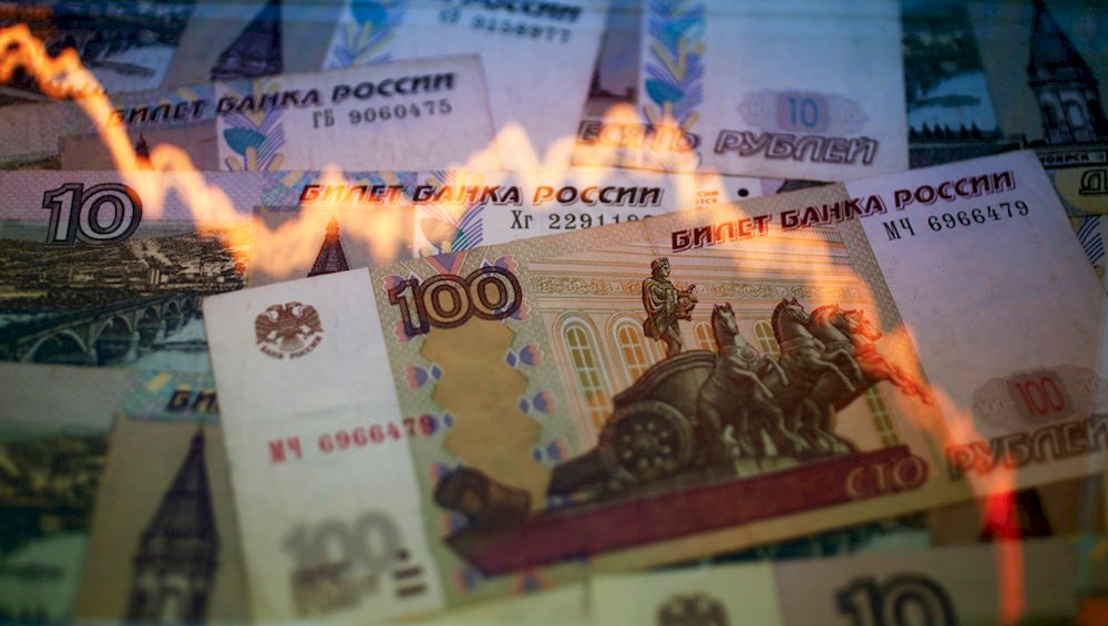 A reflection of a yearly chart of US dollars and Russian roubles are seen on rouble notes in this photo illustration taken in Warsaw November 8, 2014. u00e2u20acu2022 Reuters pic